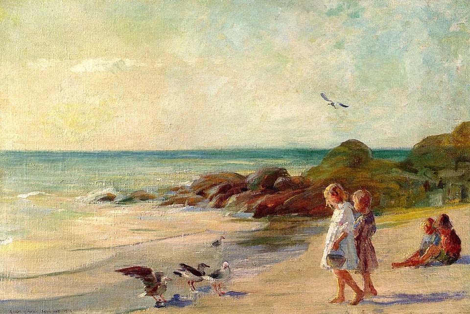 Children playing on sandy shore