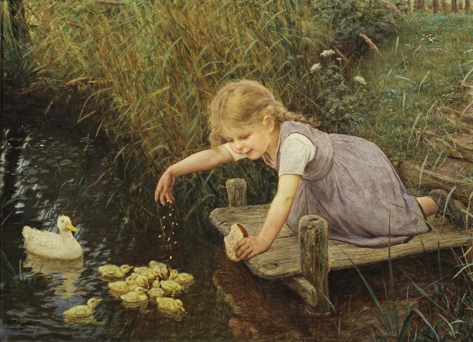 Girl on the jetty feeding ducklings