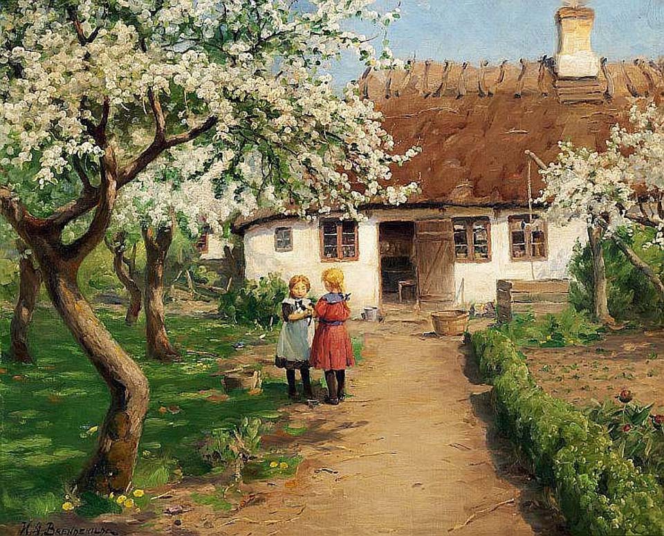 Two little girls in a flowering garden with a kitten