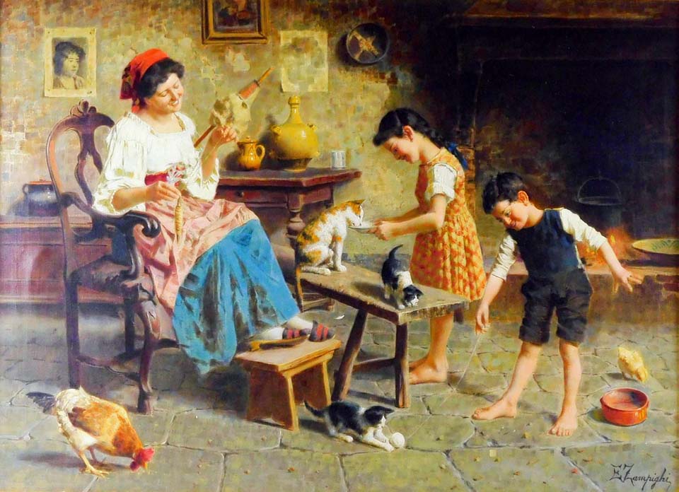 The mother and two children playing with cats