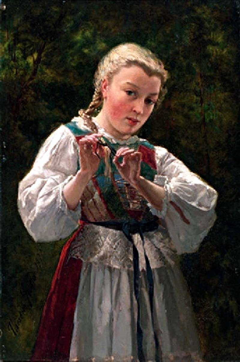 A young girl braiding her hair