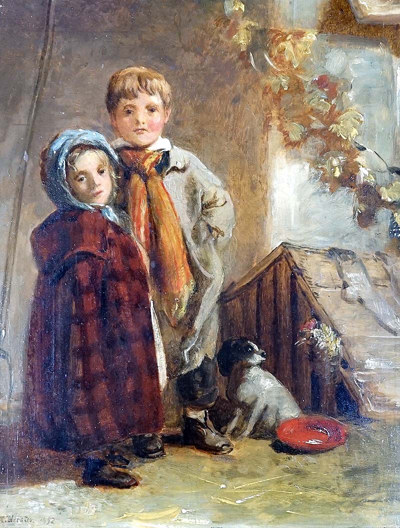 Children standing beside a kennel