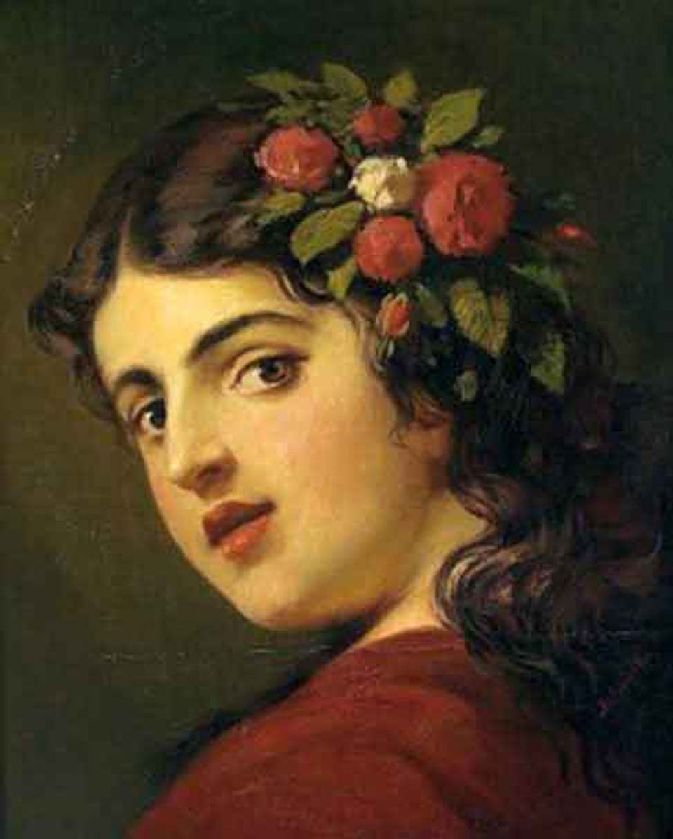 Portrait of a girl with roses in her hair
