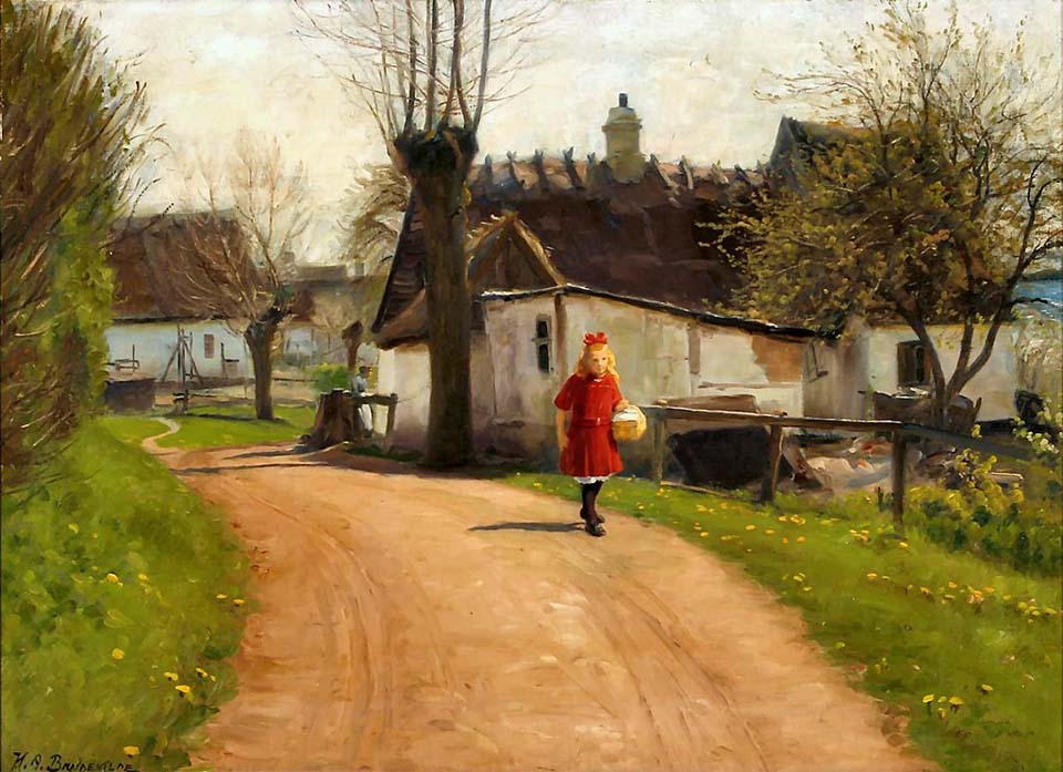 A young girl at a small village road in early spring time 