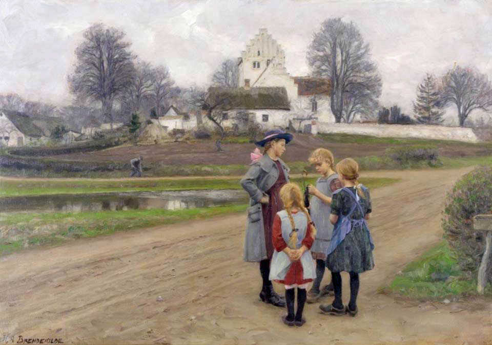 Four girls chatting in front of the village church
