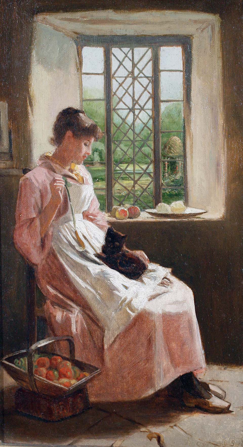A young woman and her cat seated by a window